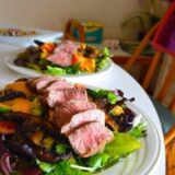 two plates of steak salad