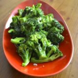 Stir-fried broccoli with garlic in red bowl