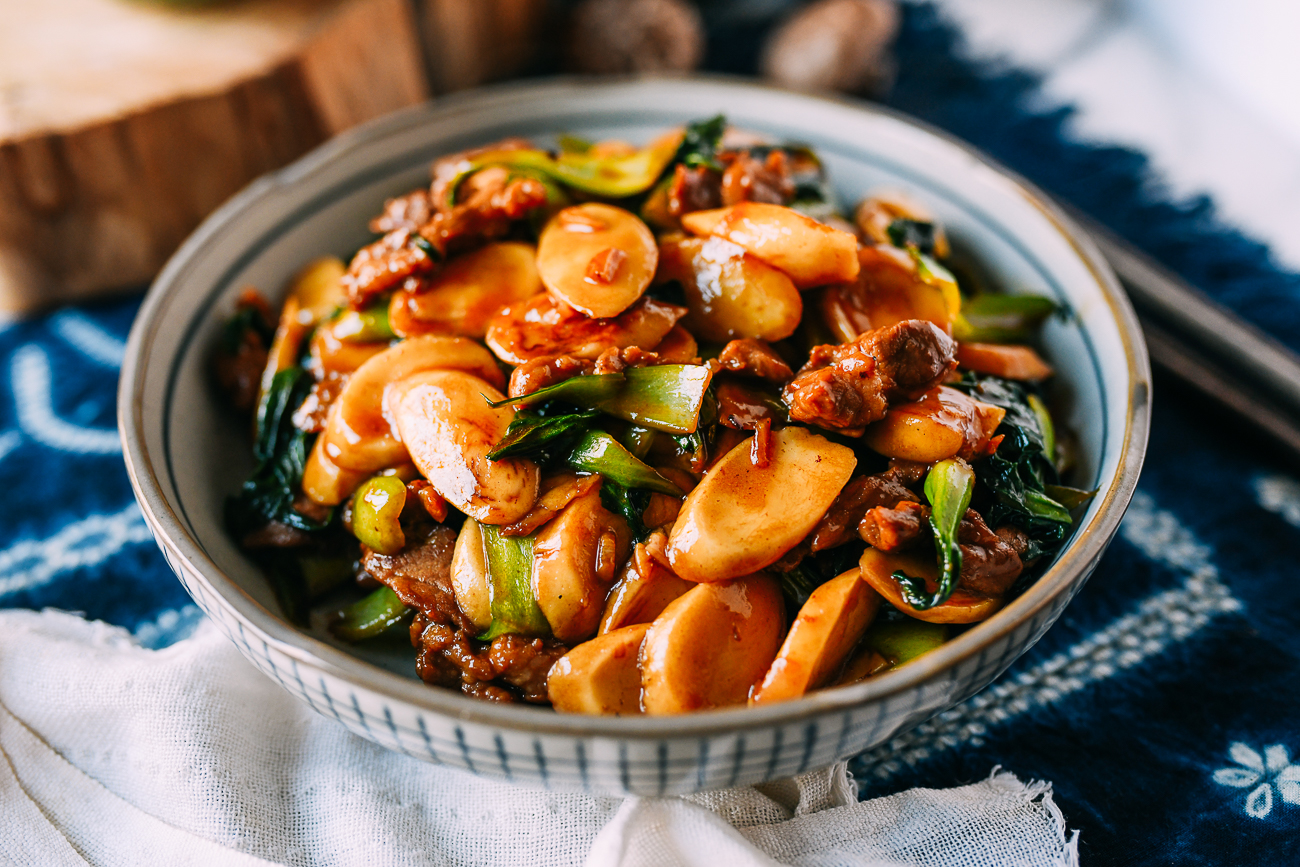 Chinese rice cakes with pork and baby bok choy
