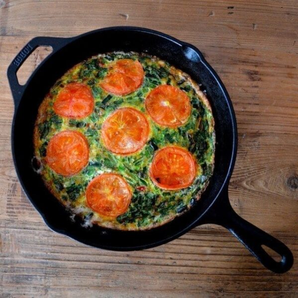 Chive tomato frittata in cast iron pan