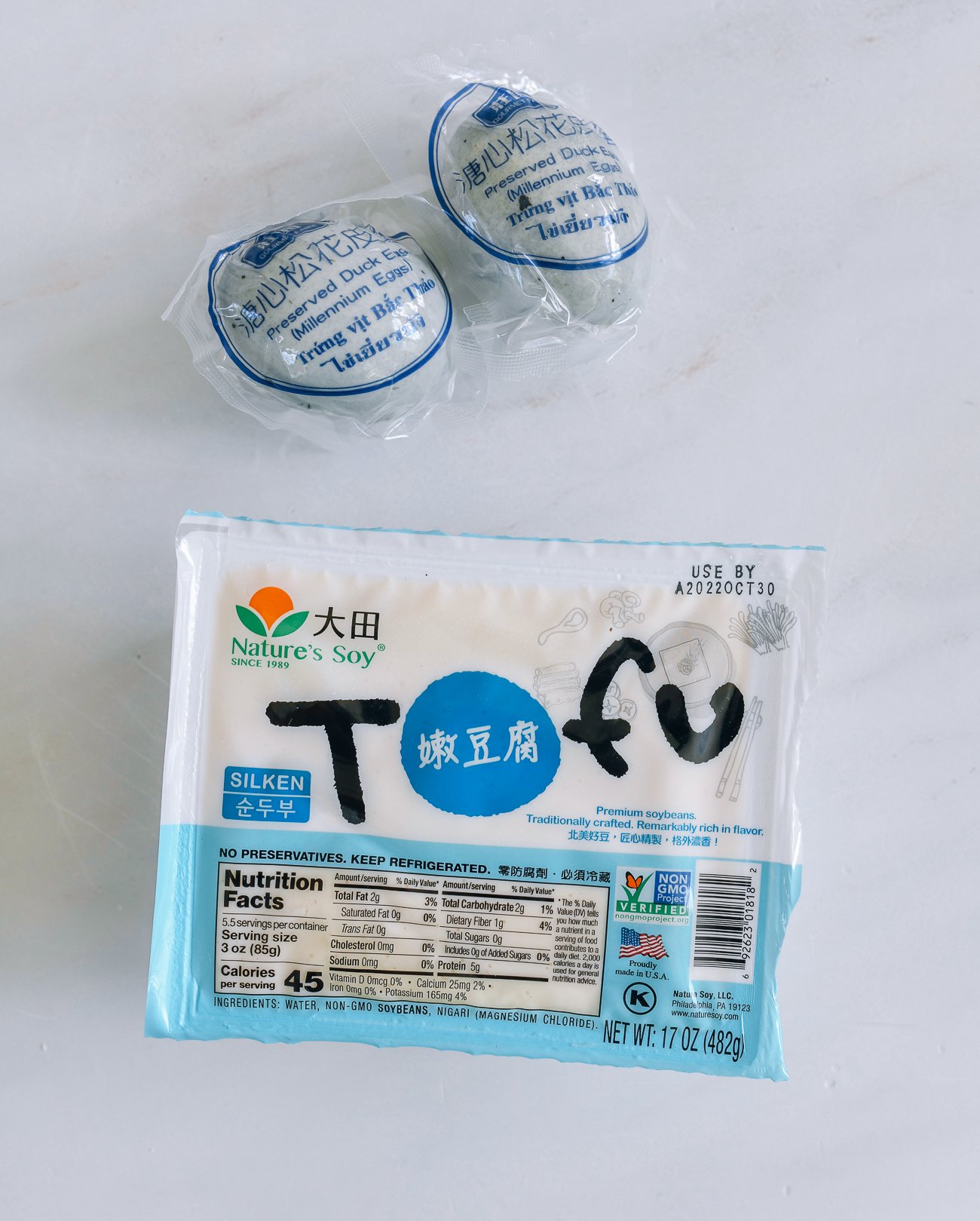 century eggs in packaging with package of soft tofu