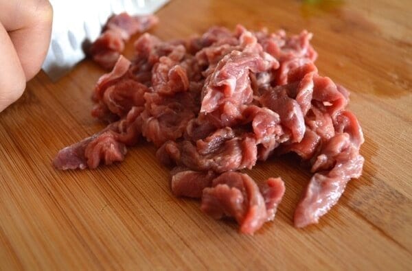 Chopping beef into small pieces