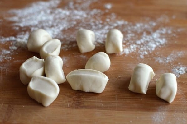 Dumpling wrapper dough cut into small pieces, by thewoksoflife.com