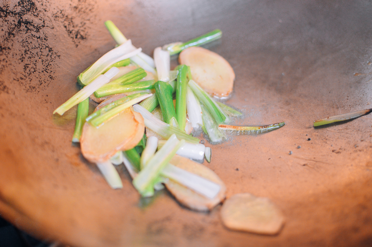scallions and ginger frying in wok