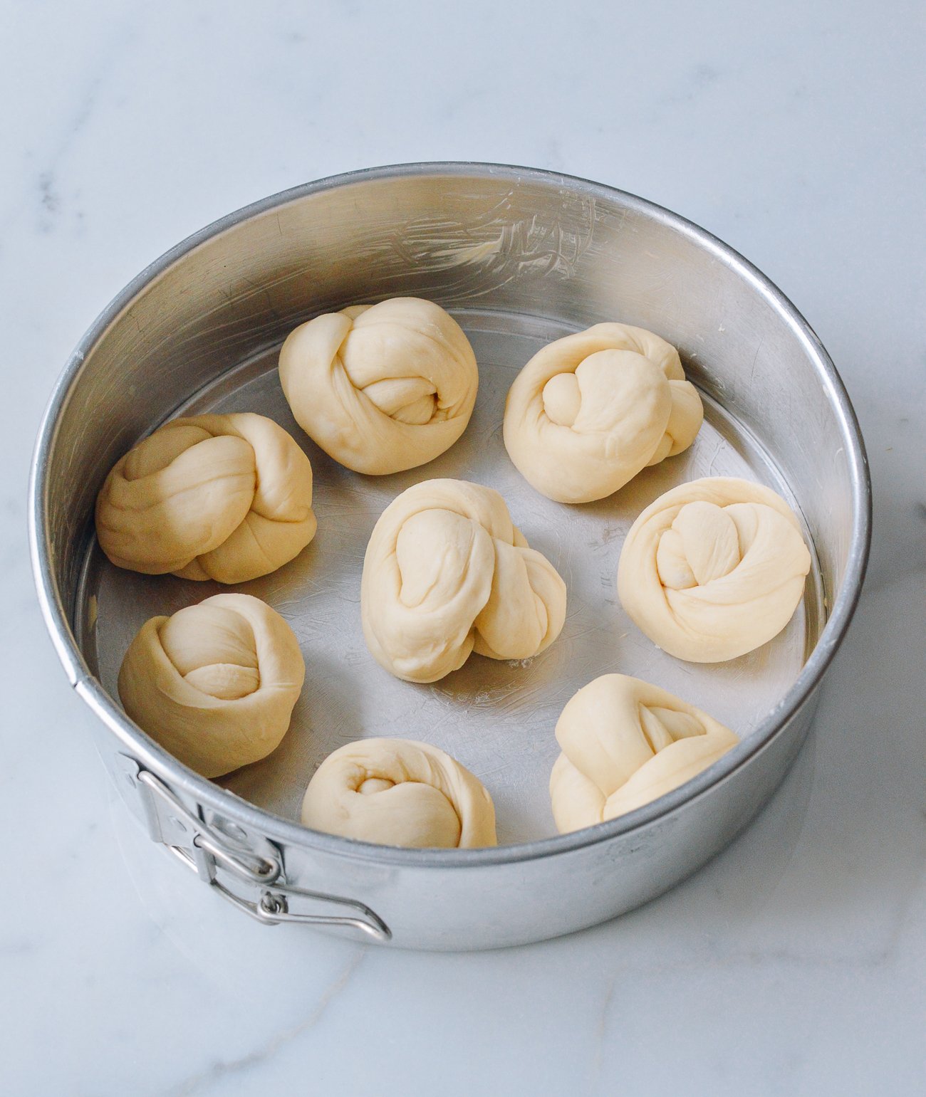 dough rolls in spring form pan