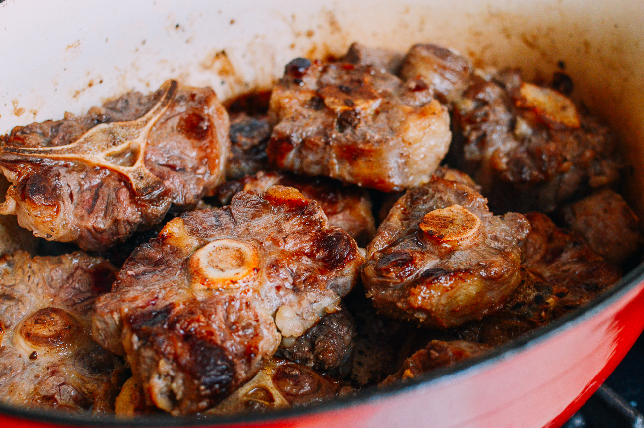 Seared oxtails in dutch oven