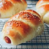 Chinese hot dog buns on cooling rack