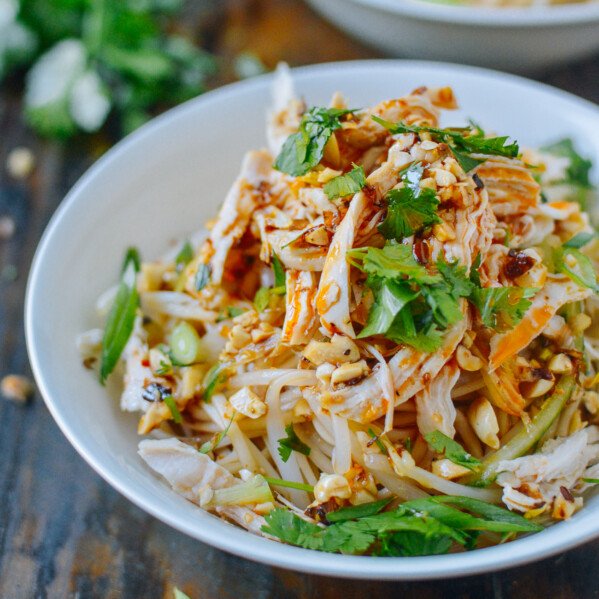 Bowl of Chinese cold noodles with shredded chicken