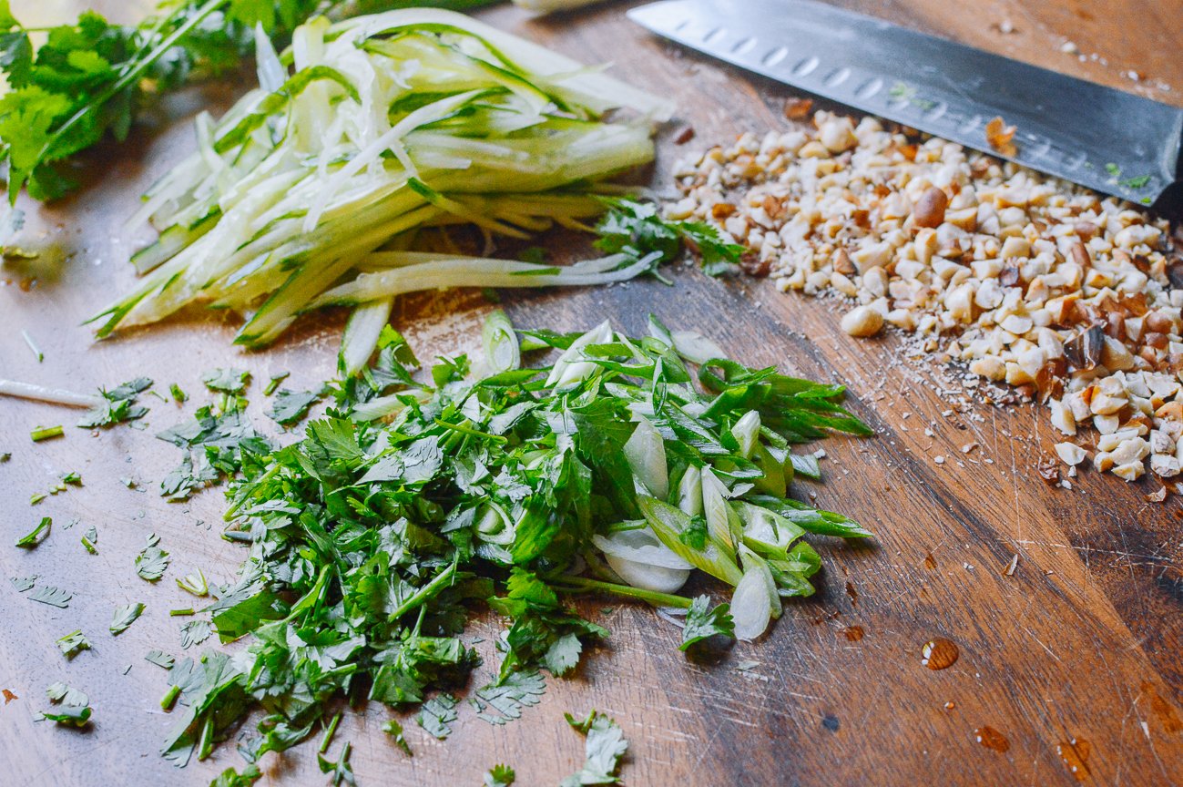 julienned cucumber, chopped cilantro, scallion, and peanuts for cold noodles