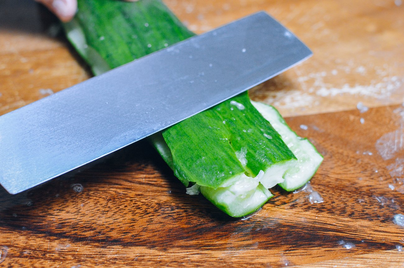 smashing cucumber with side of knife