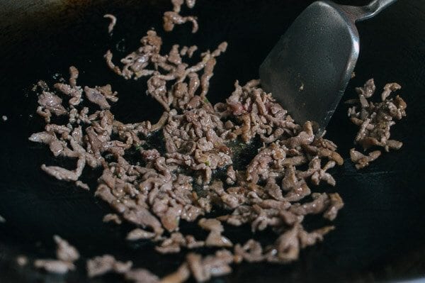 Frying the shredded pork, by thewoksoflife.com
