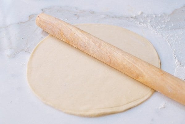 Rolling out dough for mandarin pancakes, by thewoksoflife.com