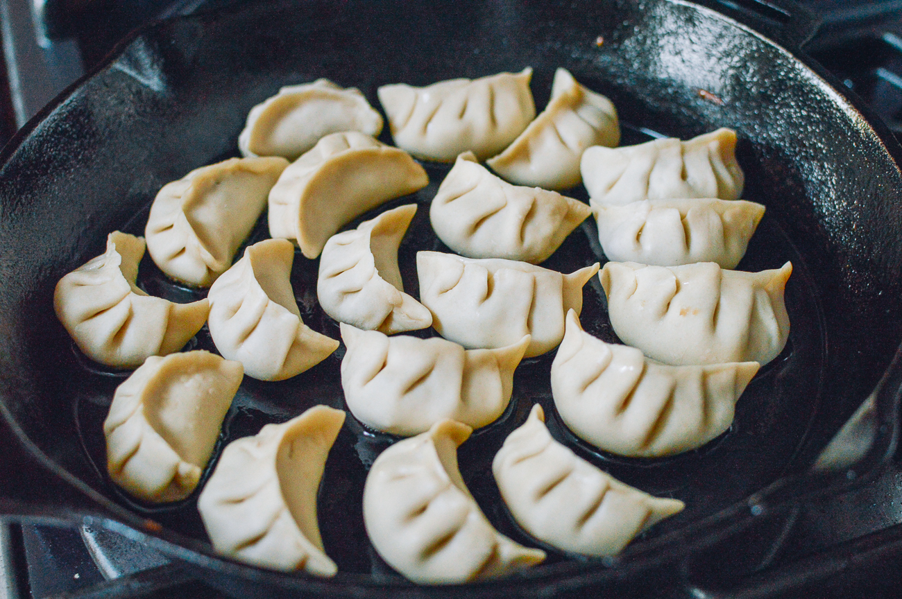dumplings in cast iron frying pan