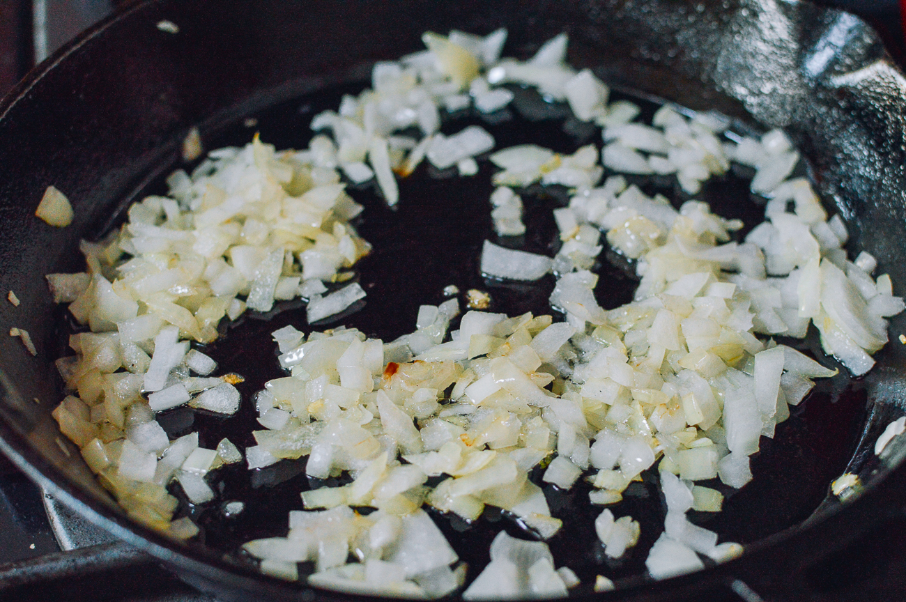 cooking chopped onions in cast iron skillet
