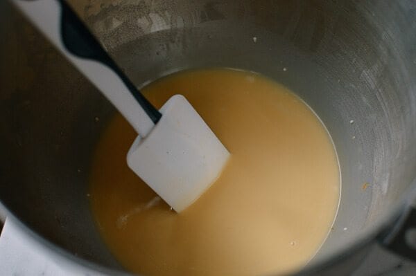 stirring custard for Cantonese Steamed Custard Buns, by thewoksoflife.com