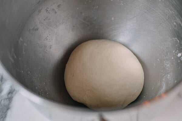 smooth dough ball in bowl for Cantonese Steamed Custard Buns (Nai Wong Bao), by thewoksoflife.com