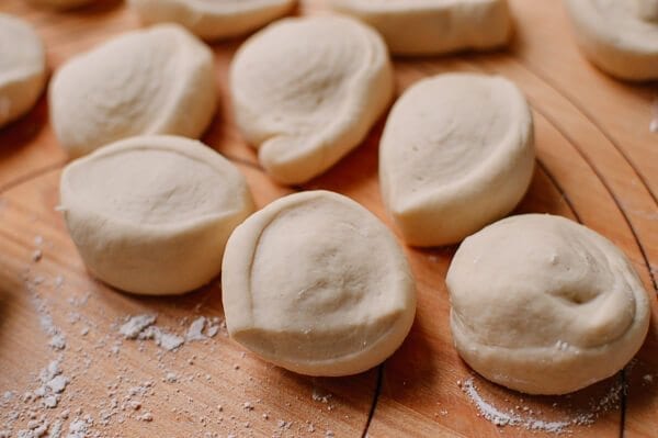 dough on floured board for Cantonese Steamed Custard Buns (Nai Wong Bao), by thewoksoflife.com