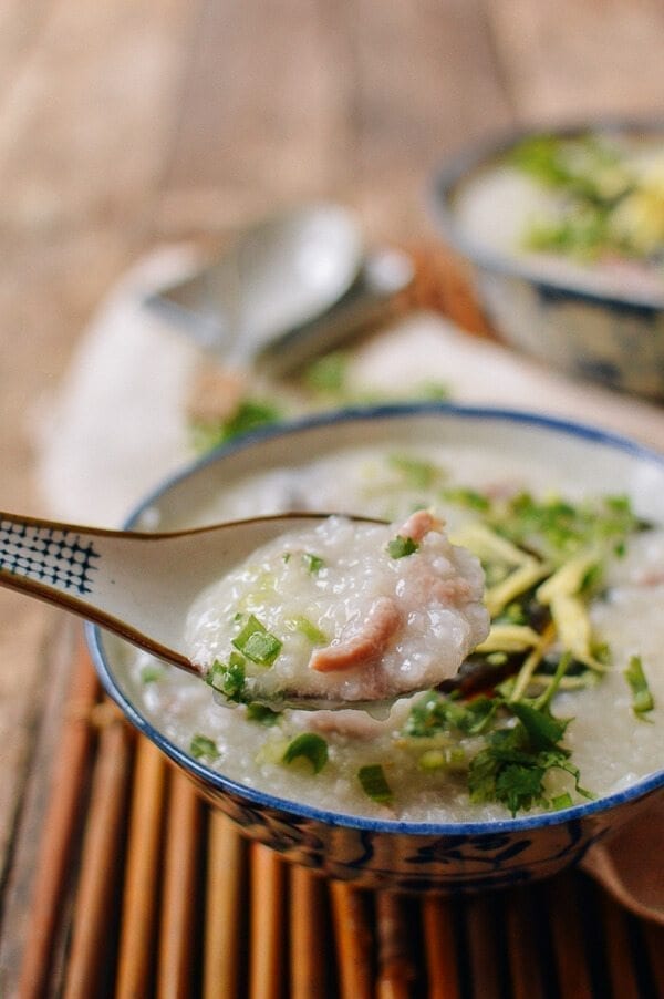Spoonful of congee with pork and thousand year old egg, by thewoksoflife.com
