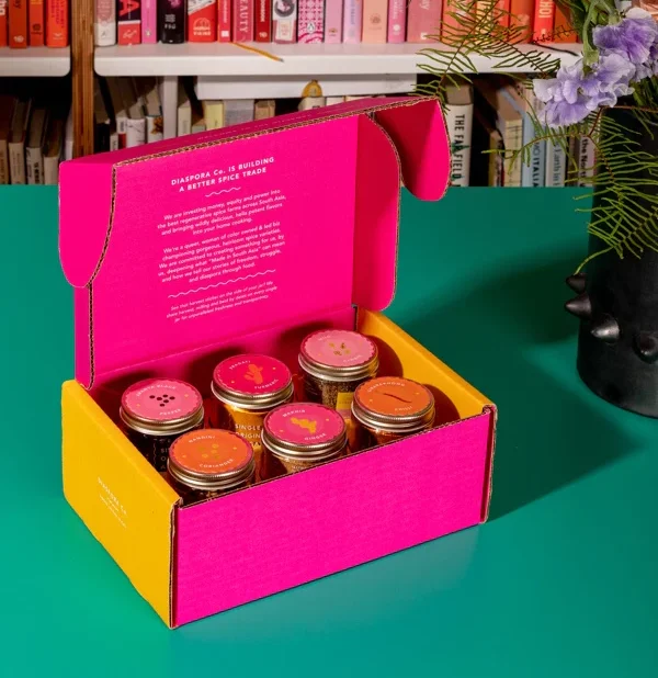 hot pink and mustard yellow box of 6 Diaspora Co spices