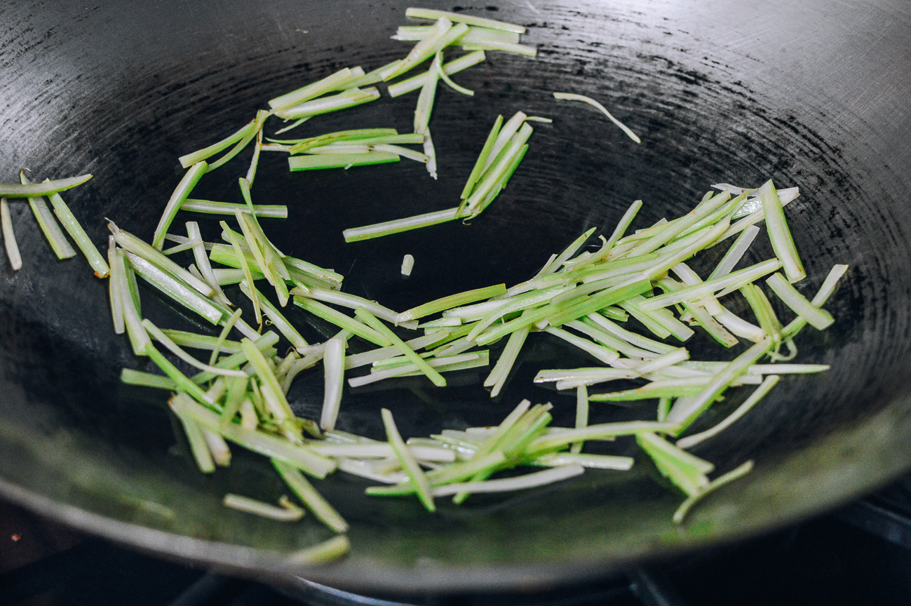 stir-frying celery in wok