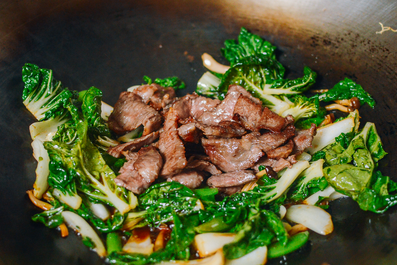beef added to vegetables for stir-frying