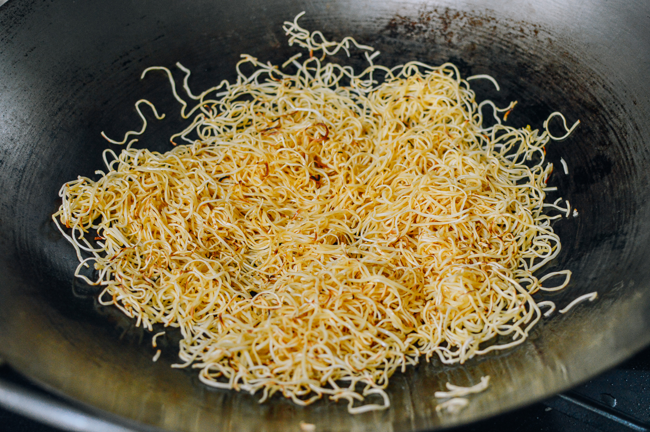 pan-frying noodles in wok