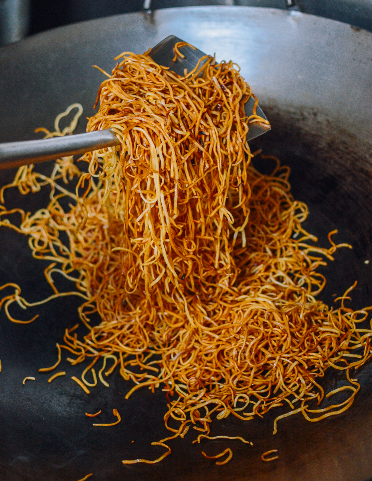sauced chow mein noodles in wok