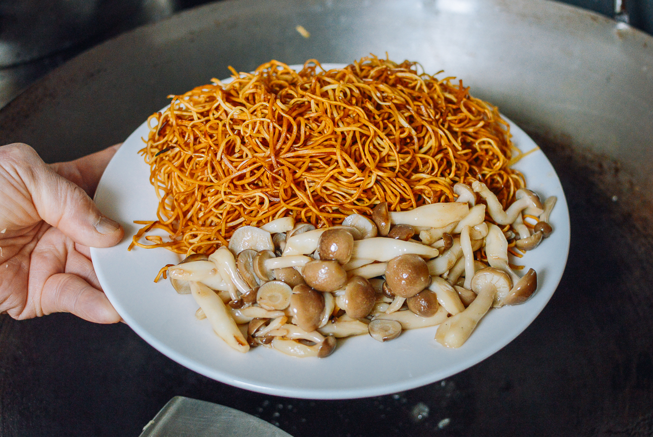 chow mein noodles and mushrooms on a plate