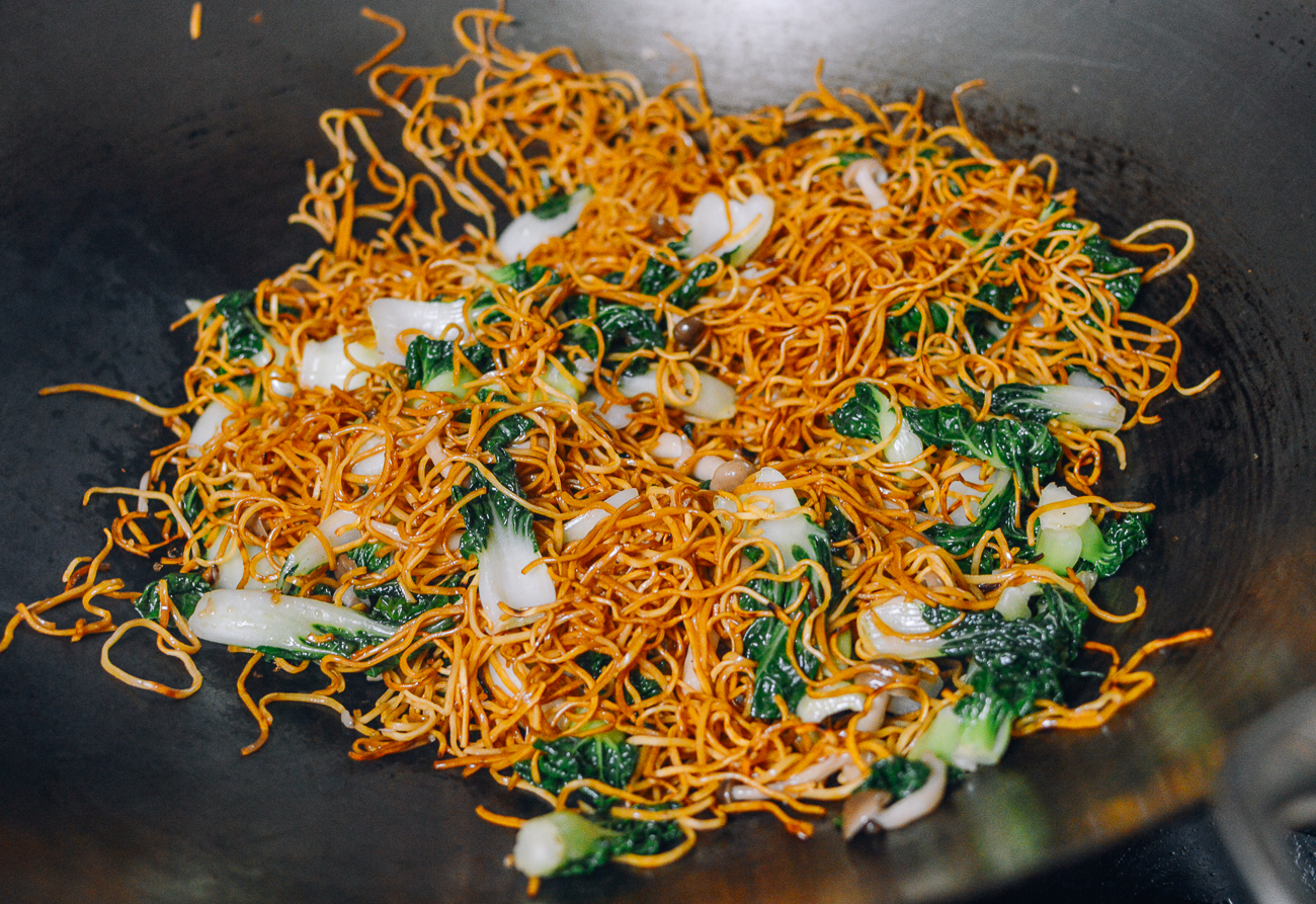 stir-frying noodles with vegetables in wok