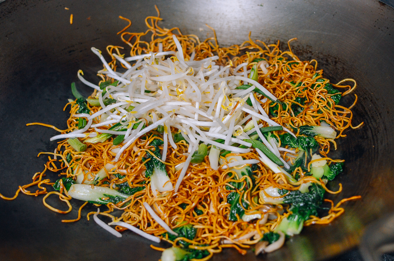 adding bean sprouts to vegetable chow mein