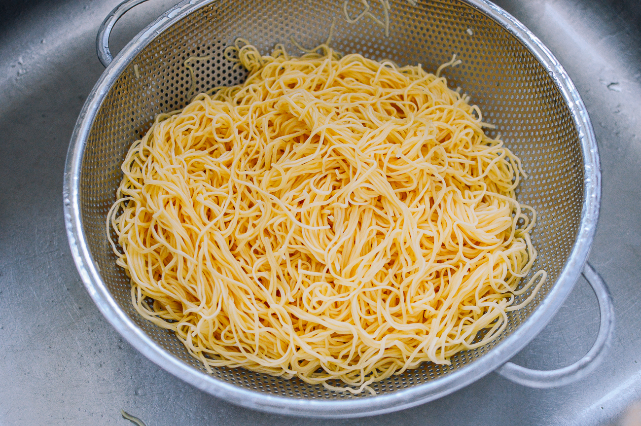 drained chow mein noodles in colander