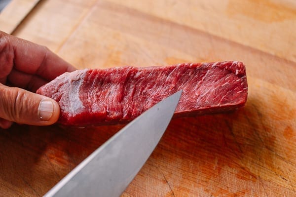 beef chuck steak on a cutting board by thewoksoflife.com
