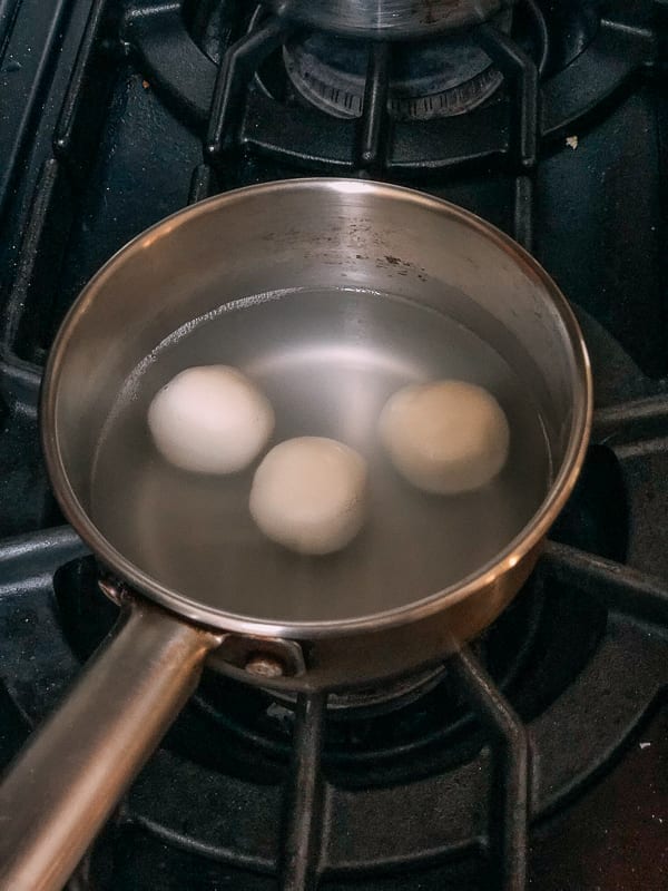 cooking rice dough ball=s in water for Savory Tang Yuan, by thewoksoflife.com