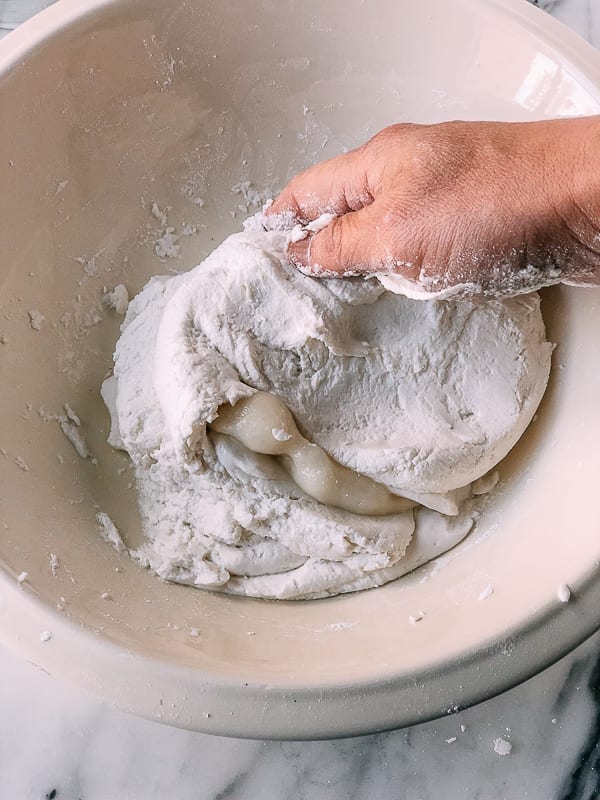 mixing cooked and raw rice flour dough in bowl, by thewoksoflife.com