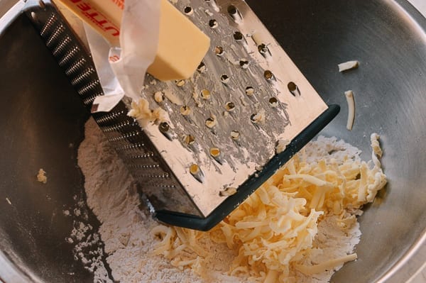 grating butter for Rough Puff Pastry, by thewoksoflife.com