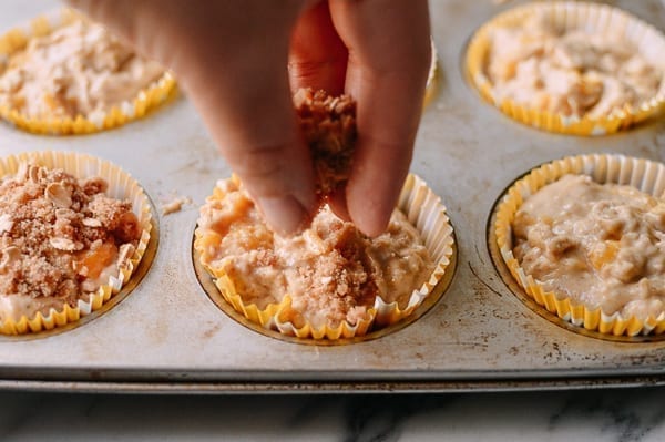 Sprinkling muffins with crumb topping, thewoksoflife.com
