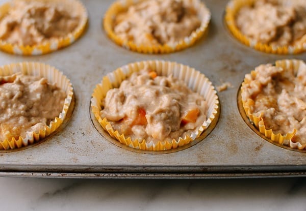 Filling muffin cups with batter, thewoksoflife.com