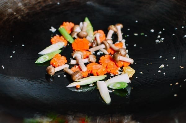 Ginger, garlic, carrot, mushrooms, and scallions in wok, thewoksoflife.com