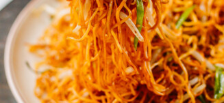 Picking up soy sauce pan-fried noodles with chopsticks