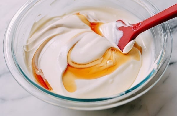 Folding yogurt and honey into cream, thewoksoflife.com