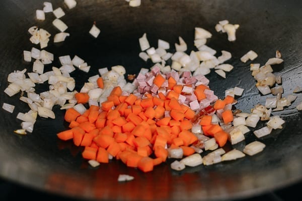 Adding carrots and ham to wok, thewoksoflife.com