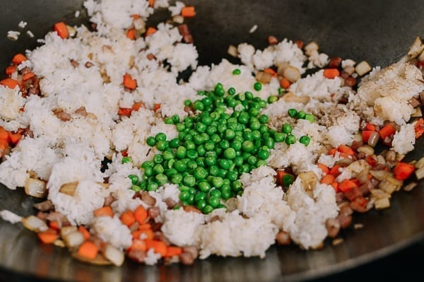 Adding peas to fried rice, thewoksoflife.com