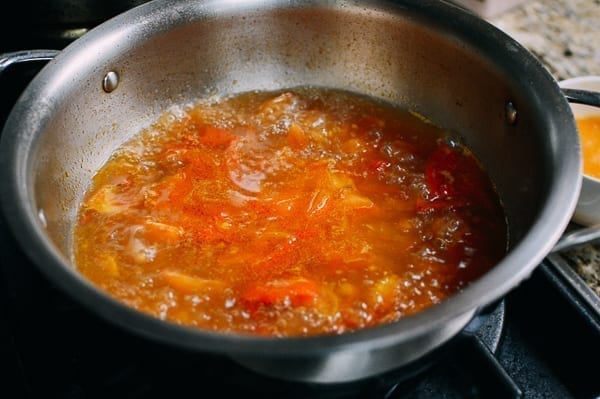 Simmering stock with tomatoes, thewoksoflife.com