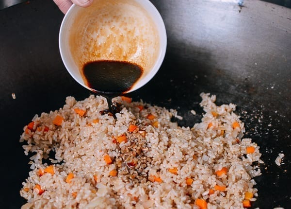 Pouring sauce over fried rice, thewoksoflife.com