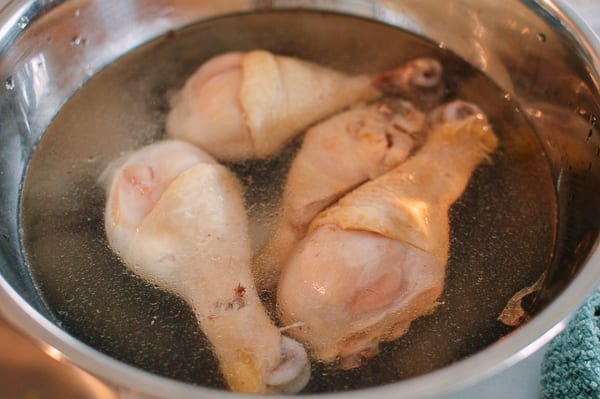 Poached chicken in cold water, thewoksoflife.com