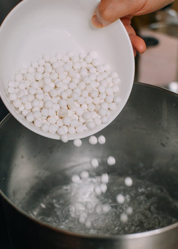Adding tapioca pearls to boiling water, thewoksoflife.com