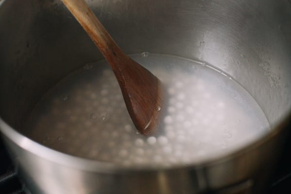 Stirring tapioca pearls in boiling water, thewoksoflife.com