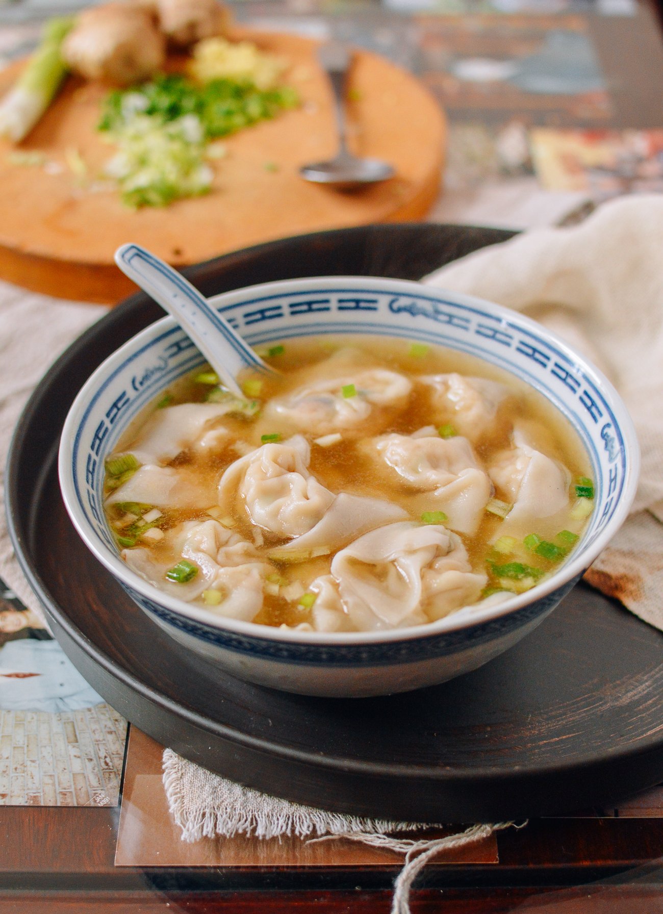 Bowl of Chicken Wonton Soup with Chinese Soup Spoon