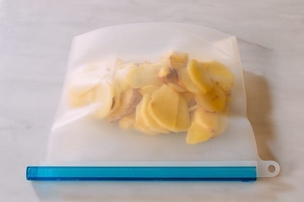 Sliced ginger in freezer bag, thewoksoflife.com