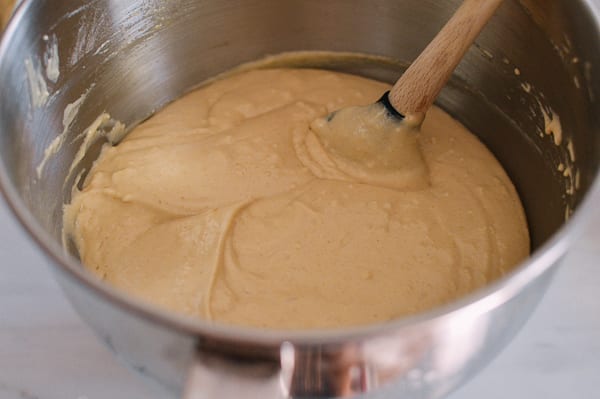 Using a spatula to ensure the batter is fully combined, thewoksoflife.com